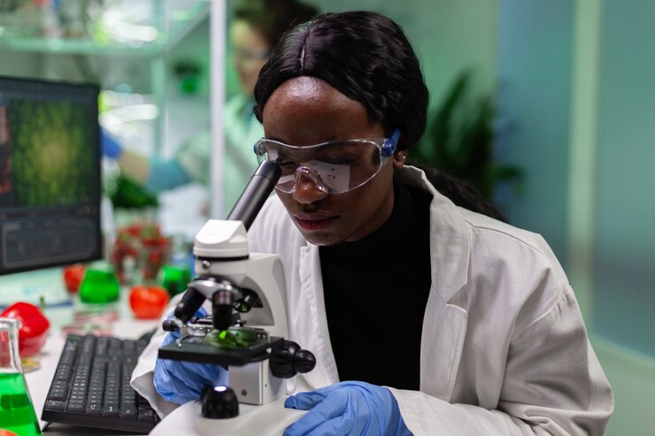 african-american-botanist-looking-leaf-sample-using-medical-microscope_482257-18792